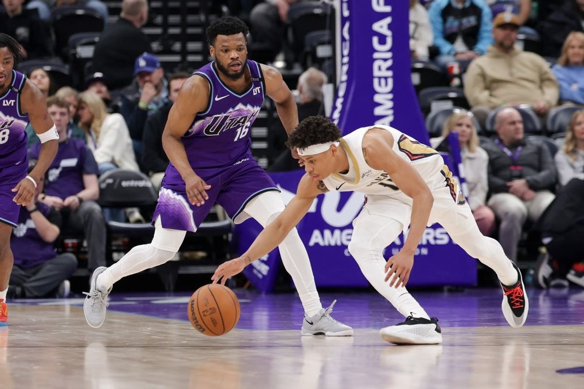 Feb 28, 2026; Salt Lake City, Utah, USA;  New Orleans Pelicans guard Jeremiah Fears (0) grabs the ball away from Utah Jazz guard Elijah Harkless (16) during the second half at Delta Center. Mandatory Credit: Chris Nicoll-Imagn Images