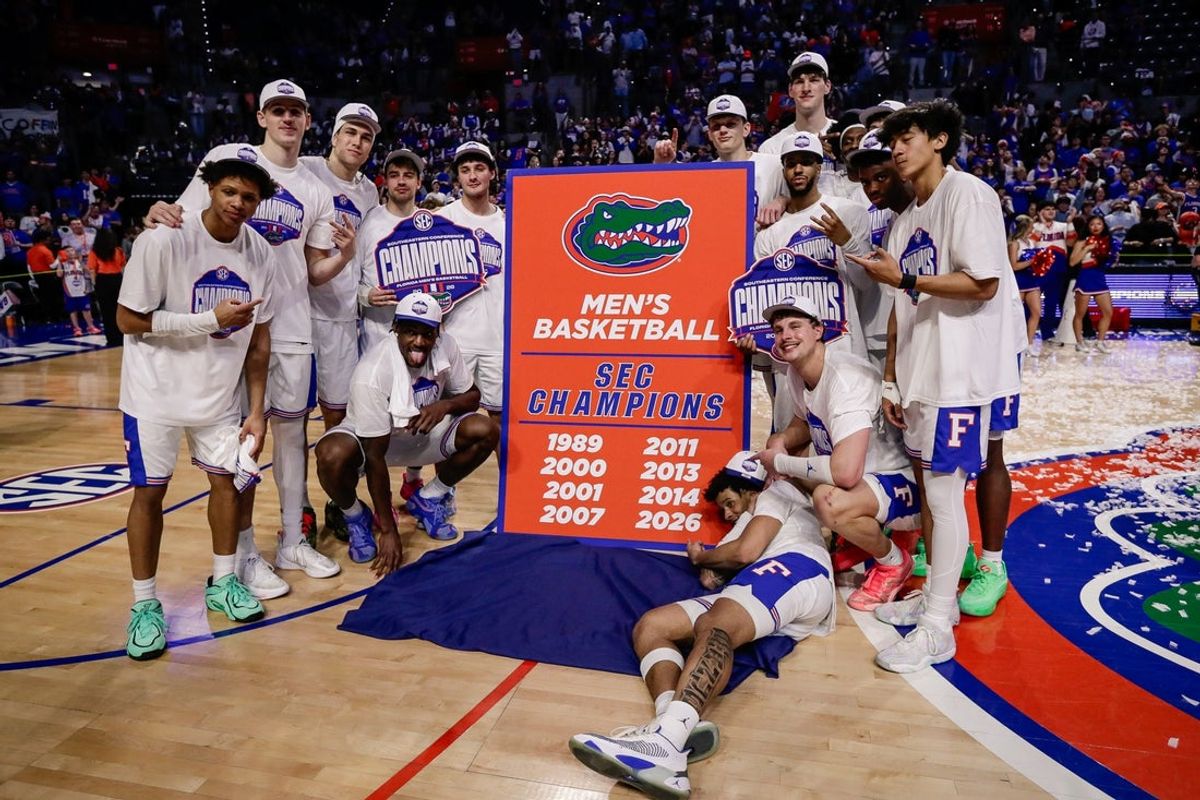 Feb 28, 2026; Gainesville, Florida, USA; Florida Gators players pose for a team photo while celebrating the SEC regular season championship following the game against the Arkansas Razorbacks at Exactech Arena at the Stephen C. O'Connell Center. Mandatory Credit: Travis Register-Imagn Images