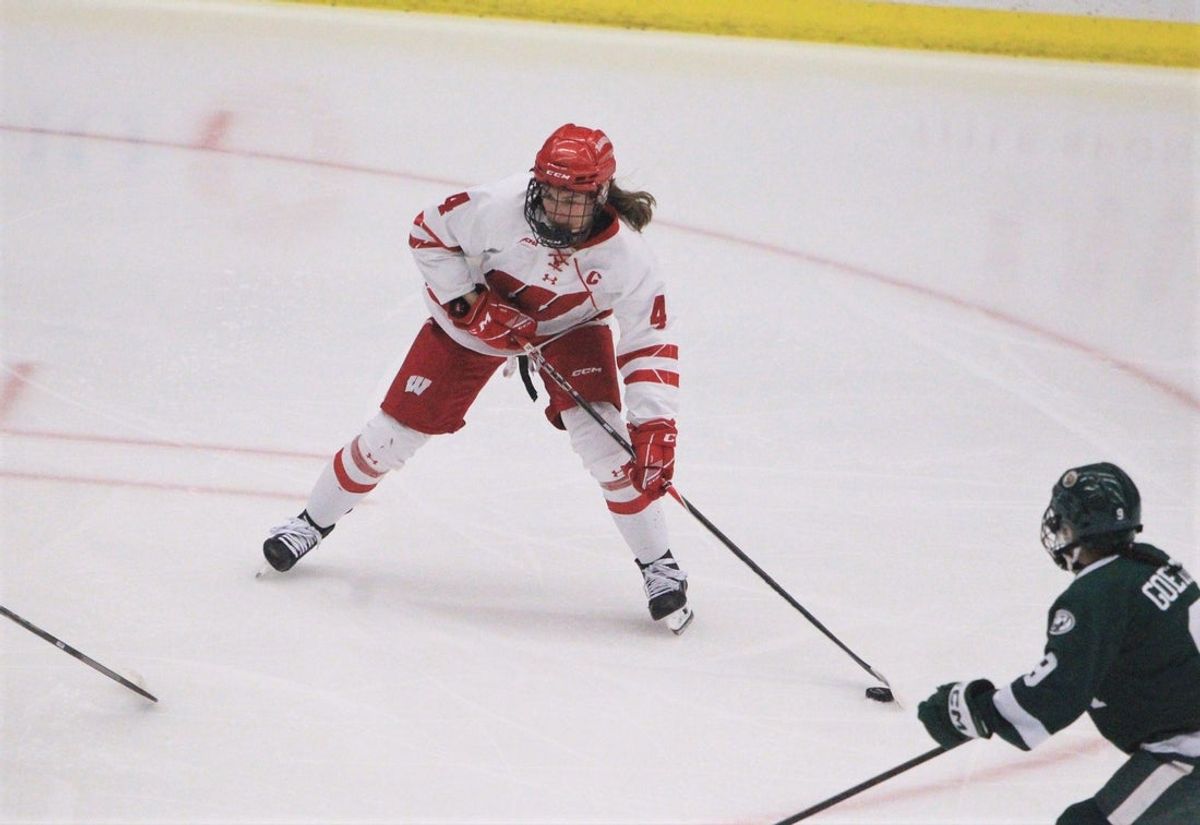 Wisconsin defender Caroline Harvey handles the puck against Bemidji State during a WCHA first-round playoff game Feb. 27, 2026 at LaBahn Arena in Madison, Wis. Wisconsin won, 7-0.