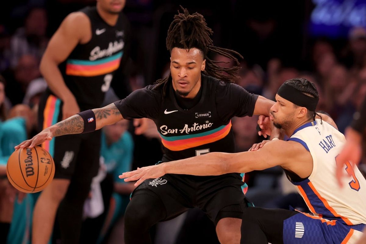 Mar 1, 2026; New York, New York, USA; San Antonio Spurs guard Stephon Castle (5) controls the ball against New York Knicks guard Josh Hart (3) during the second quarter at Madison Square Garden. Mandatory Credit: Brad Penner-Imagn Images