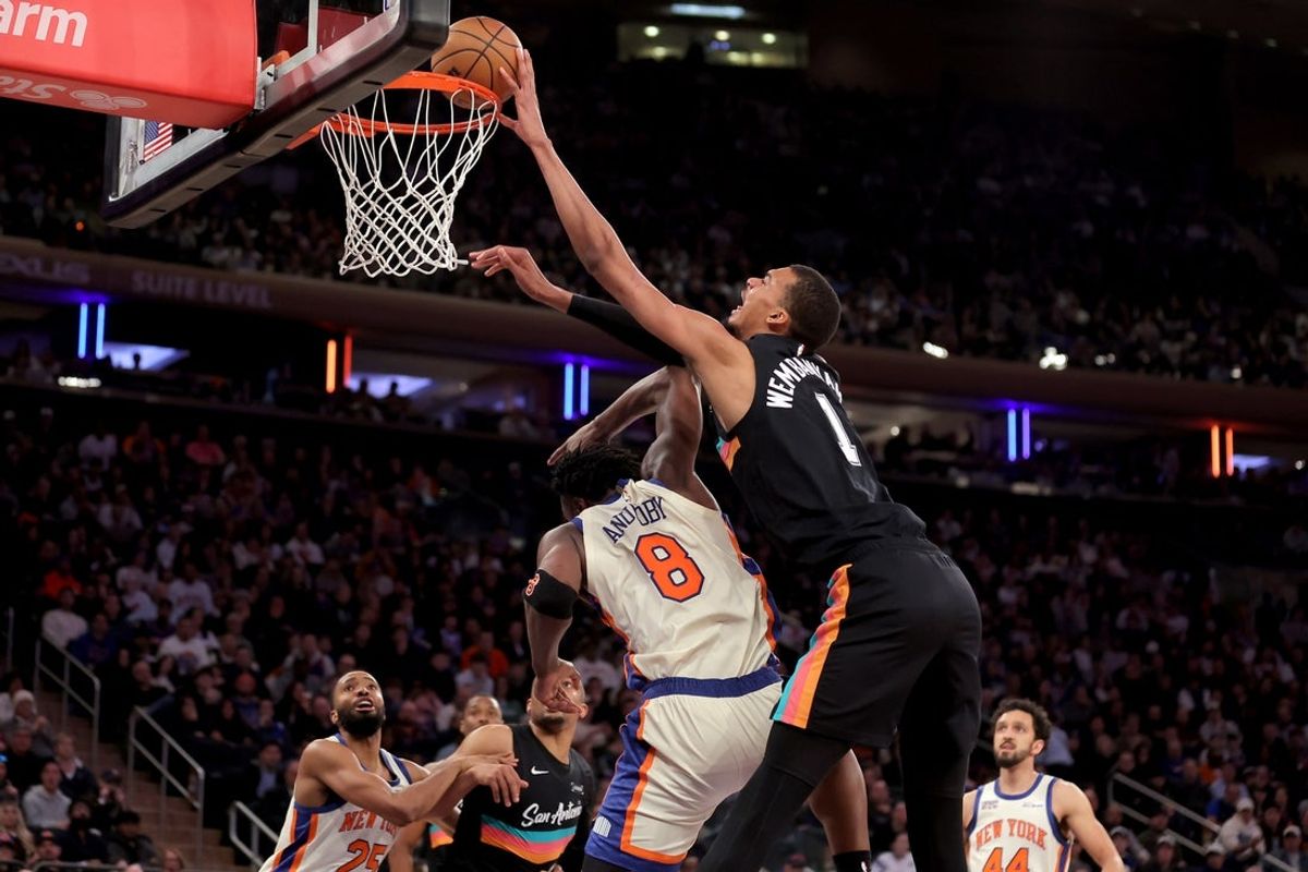 Mar 1, 2026; New York, New York, USA; San Antonio Spurs forward Victor Wembanyama (1) dunks over New York Knicks forward OG Anunoby (8) during the third quarter at Madison Square Garden. Mandatory Credit: Brad Penner-Imagn Images