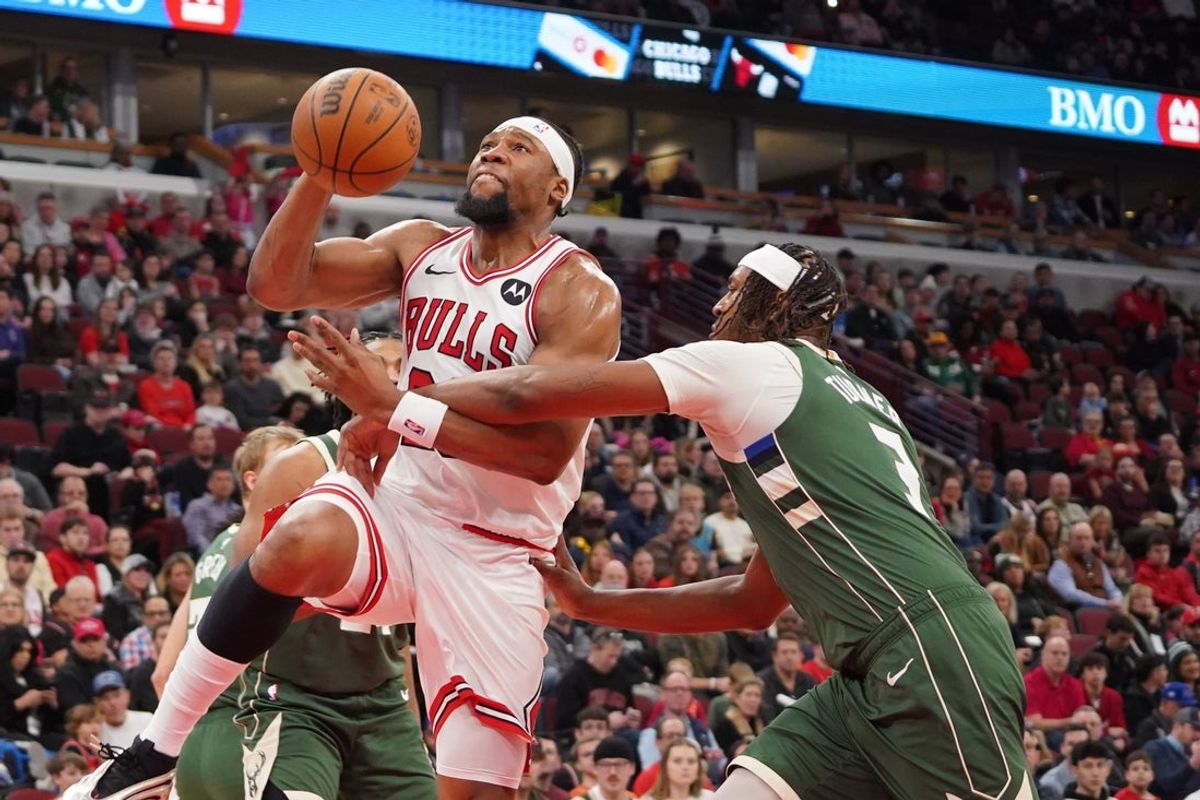 Mar 1, 2026; Chicago, Illinois, USA; Milwaukee Bucks guard/forward Kevin Porter Jr. (7) defends Chicago Bulls forward Guerschon Yabusele (28) during the first half at United Center. Mandatory Credit: David Banks-Imagn Images