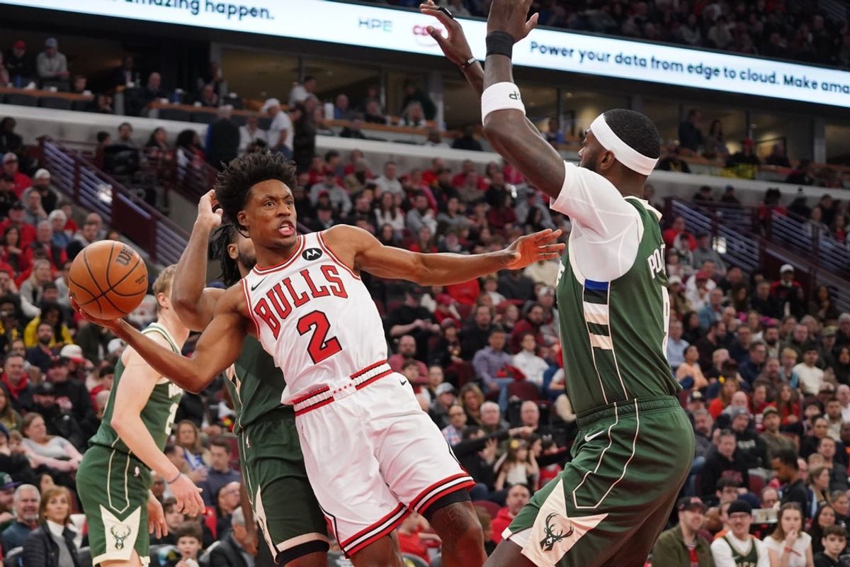 Mar 1, 2026; Chicago, Illinois, USA; Chicago Bulls guard Collin Sexton (2) looks to pass the ball around Milwaukee Bucks forward Bobby Portis (9) during the first half at United Center. Mandatory Credit: David Banks-Imagn Images