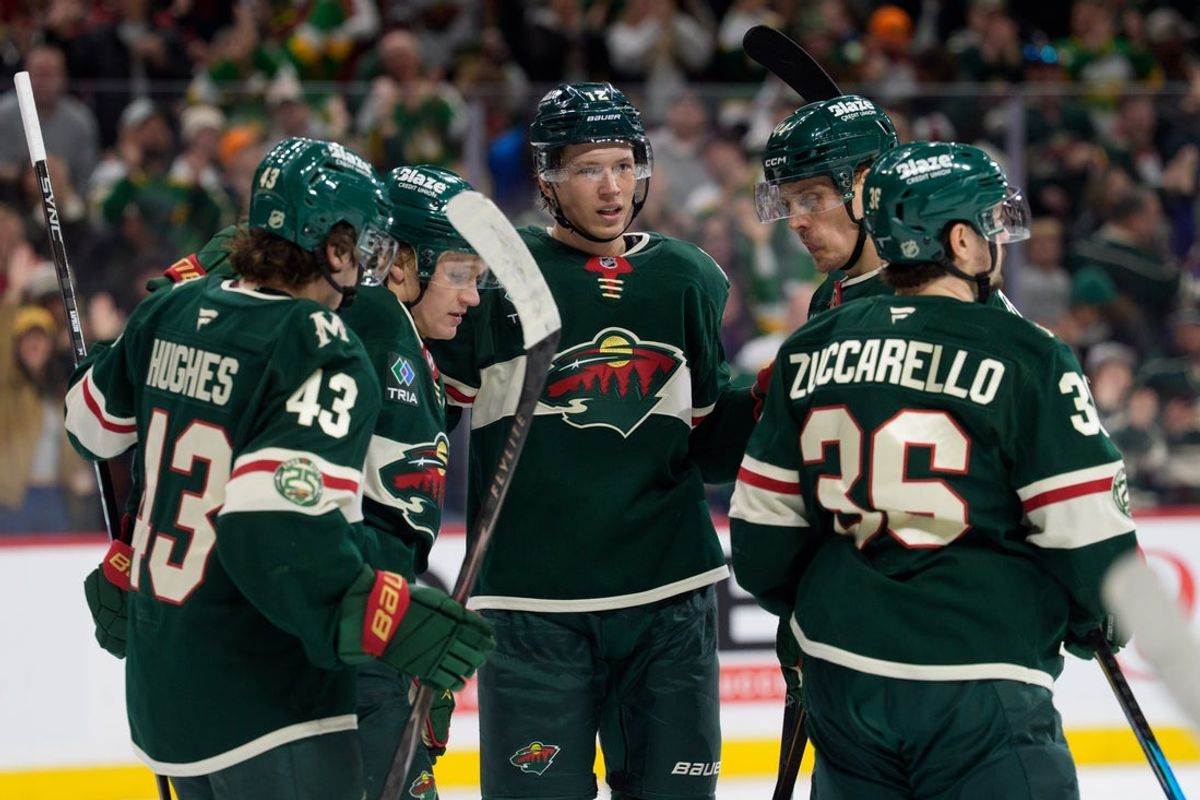 Mar 1, 2026; Saint Paul, Minnesota, USA; Minnesota Wild left wing Kirill Kaprizov (97) is congratulated by left wing Matt Boldy (12), center Joel Eriksson Ek (14) and defenseman Quinn Hughes (43) after scoring against the St. Louis Blues in the second period at Grand Casino Arena. Mandatory Credit: Matt Blewett-Imagn Images