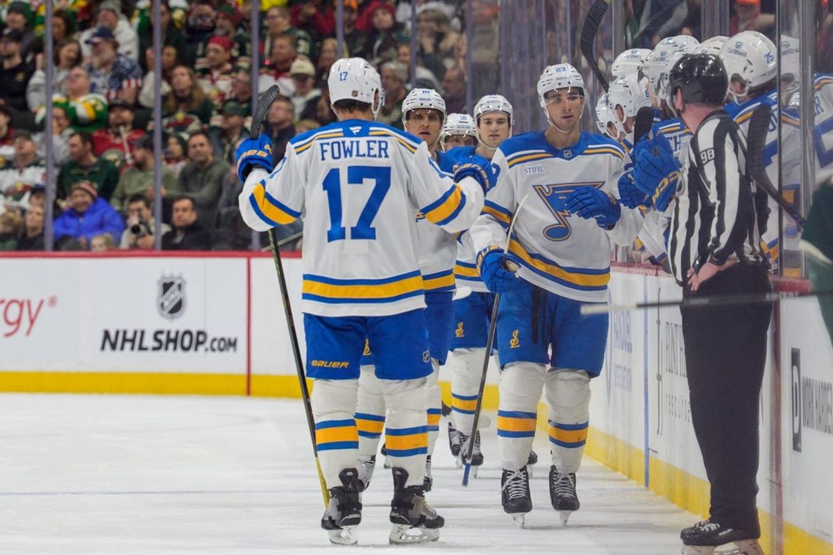Mar 1, 2026; Saint Paul, Minnesota, USA; St. Louis Blues defenseman Logan Mailloux (23) skates by the bench in celebration after scoring on the Minnesota Wild in the second period at Grand Casino Arena. Mandatory Credit: Matt Blewett-Imagn Images