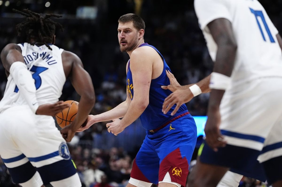 Mar 1, 2026; Denver, Colorado, USA; Denver Nuggets center Nikola Jokic (15) passes the ball in the second half against the Minnesota Timberwolves at Ball Arena. Mandatory Credit: Ron Chenoy-Imagn Images