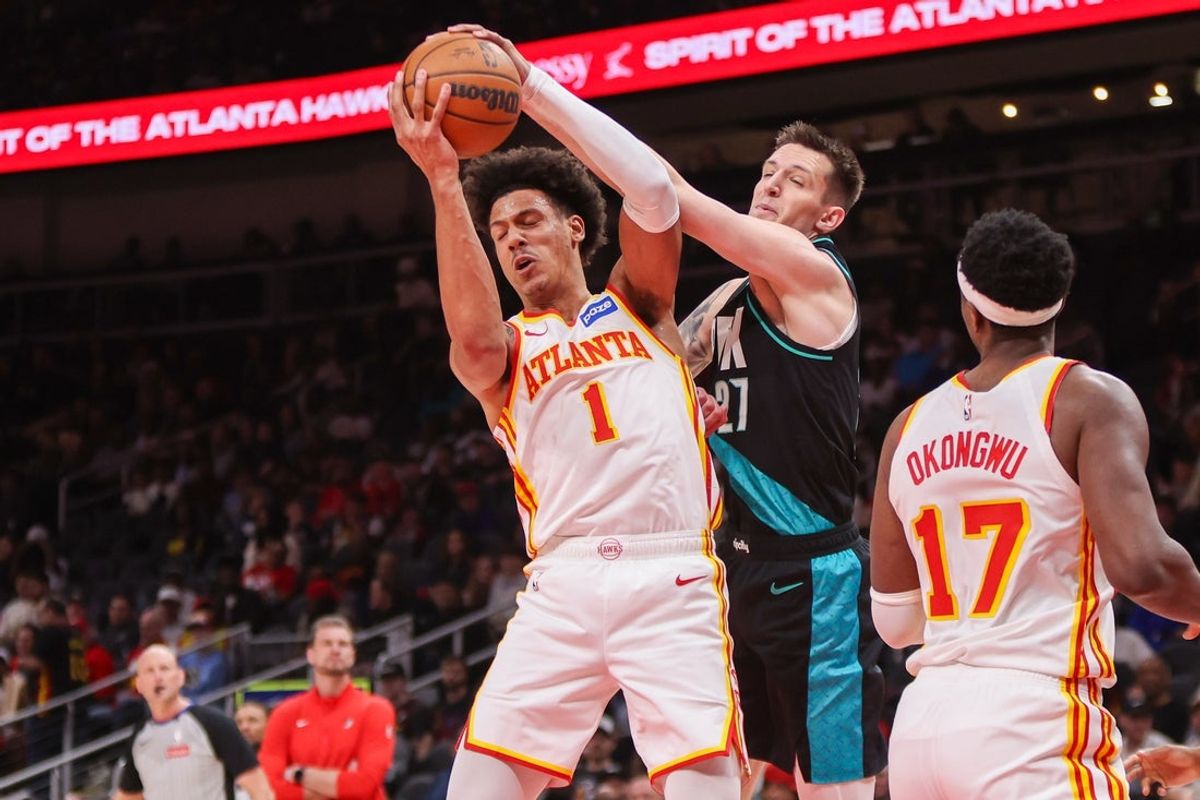 Mar 1, 2026; Atlanta, Georgia, USA; Atlanta Hawks forward Jalen Johnson (1) grabs a rebound past Portland Trail Blazers guard Vit Krejci (27) in the second quarter at State Farm Arena. Mandatory Credit: Brett Davis-Imagn Images