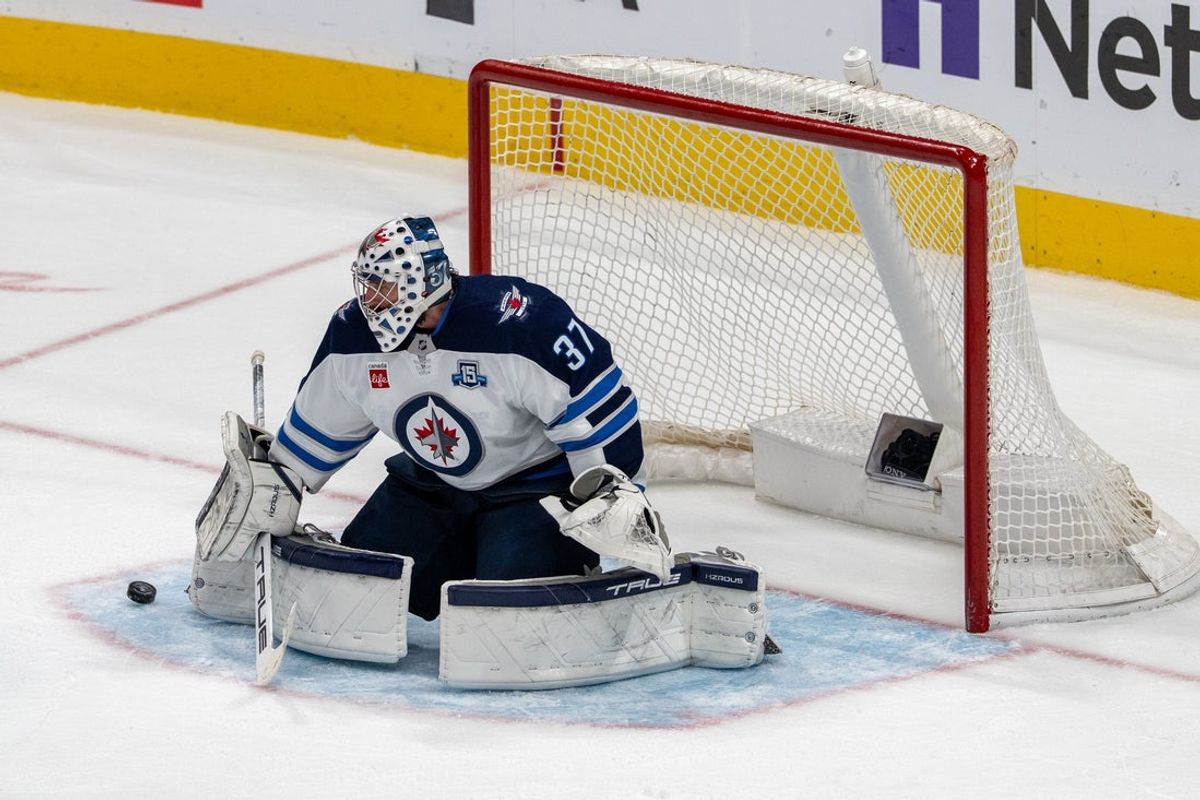 March 1, 2026; San Jose, California, USA; Winnipeg Jets goaltender Connor Hellebuyck (37) makes a save against the San Jose Sharks during the third period at SAP Center at San Jose. Mandatory Credit: Neville E. Guard-Imagn Images
