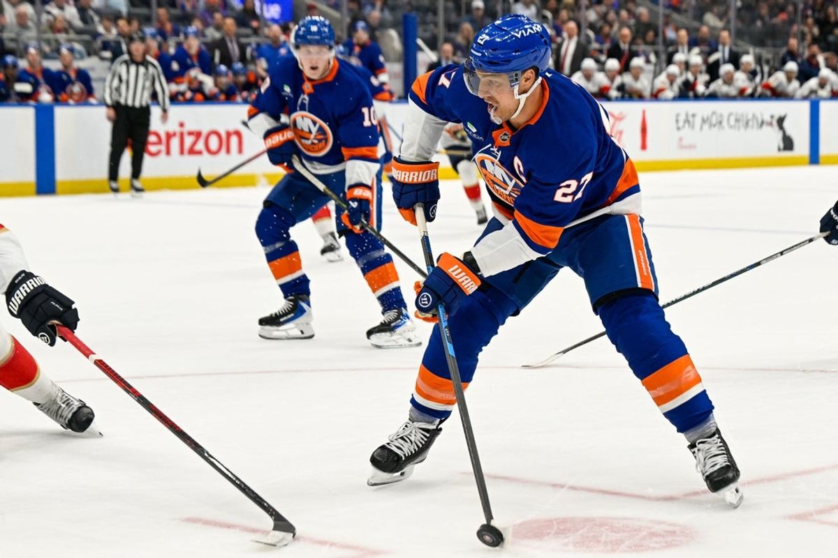 Mar 1, 2026; Elmont, New York, USA;  New York Islanders left wing Anders Lee (27) controls the puck against the Florida Panthers during the first period at UBS Arena. Mandatory Credit: Dennis Schneidler-Imagn Images