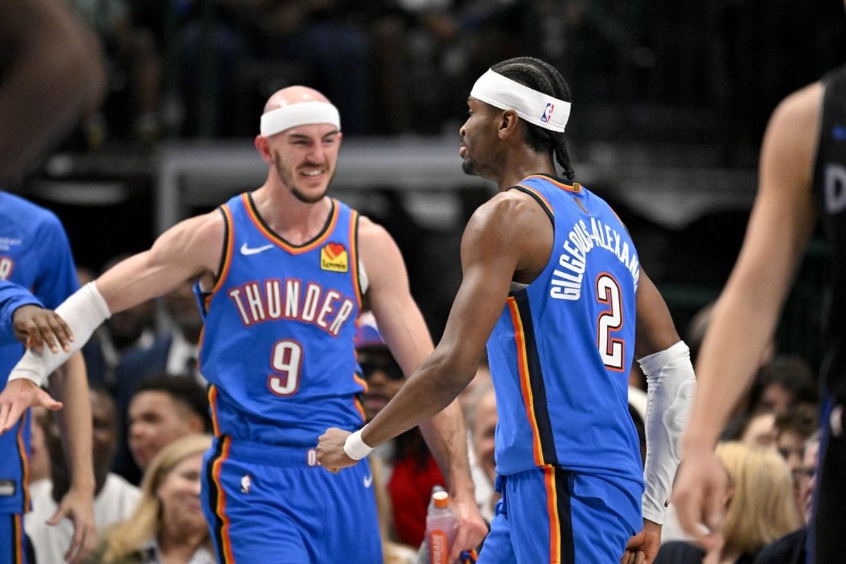 Mar 1, 2026; Dallas, Texas, USA; Oklahoma City Thunder guard Alex Caruso (9) and guard Shai Gilgeous-Alexander (2) celebrate after Gilgeous-Alexander dunks the ball against the Dallas Mavericks during the second quarter at the American Airlines Center. Mandatory Credit: Jerome Miron-Imagn Images