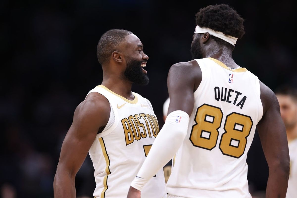 Mar 1, 2026; Boston, Massachusetts, USA; Boston Celtics forward Jaylen Brown (7) and Boston Celtics center Neemias Queta (88) celebrate during the first half against the Philadelphia 76ers at TD Garden. Mandatory Credit: Paul Rutherford-Imagn Images