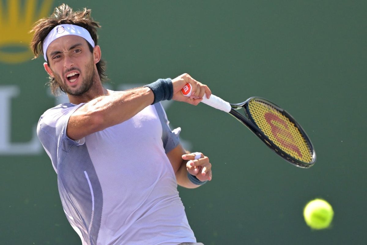 Mar 2, 2026; Indian Wells, CA, USA;  Thiago Agustin Tirante (ARG) hits a shot during his qualifying match against Izyan Ahmad (USA) during the BNP Paribas Open at the Indian Wells Tennis Garden. Mandatory Credit: Jayne Kamin-Oncea-Imagn Images