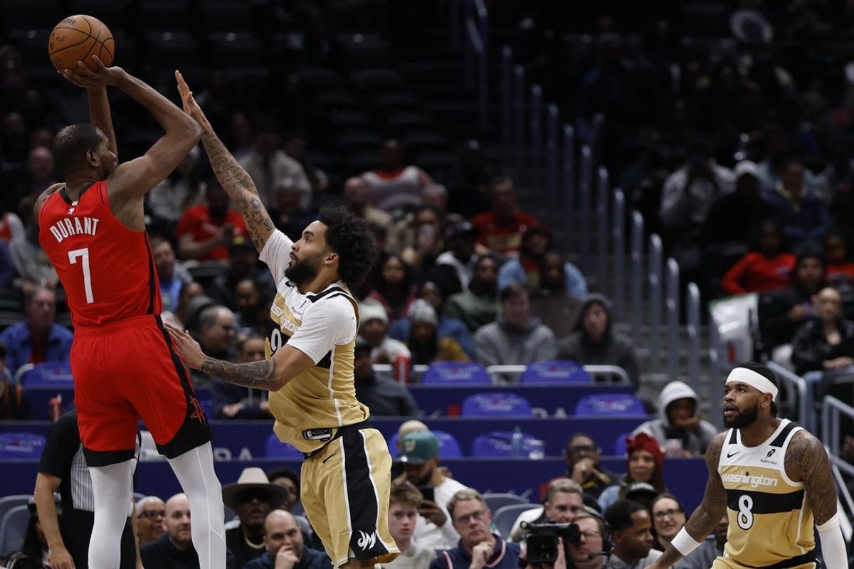 Mar 2, 2026; Washington, District of Columbia, USA; Houston Rockets forward Kevin Durant (7) shoots the ball over Washington Wizards forward Justin Champagnie (9) in the first half at Capital One Arena. Mandatory Credit: Geoff Burke-Imagn Images