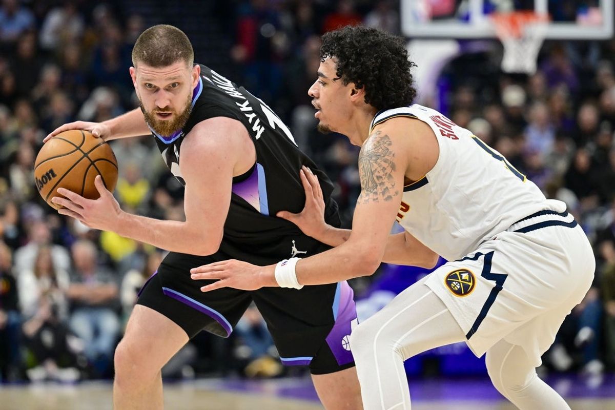 Mar 2, 2026; Salt Lake City, Utah, USA; Utah Jazz guard/forward Svi Mykhailiuk (10) plans his next move against Denver Nuggets guard Julian Strawther (3) during the first half at Delta Center. Mandatory Credit: Peter Creveling-Imagn Images