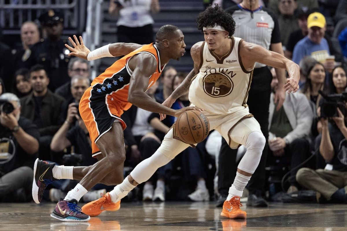 Mar 2, 2026; San Francisco, California, USA; Los Angeles Clippers guard Kris Dunn (8) drives past Golden State Warriors forward Gui Santos (15) during the second quarter at Chase Center. Mandatory Credit: D. Ross Cameron-Imagn Images