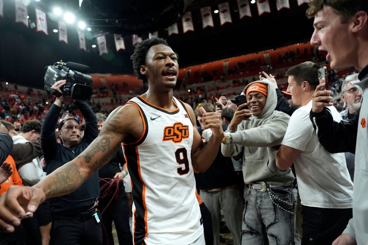 Oklahoma State Cowboys guard Anthony Roy (9) celebrates with fans after a BIG 12 men's college basketball game between the Oklahoma State Cowboys (OSU) and the BYU Cougars at Gallagher-Iba Arena in Stillwater, Okla., Wednesday, Feb. 4, 2026.