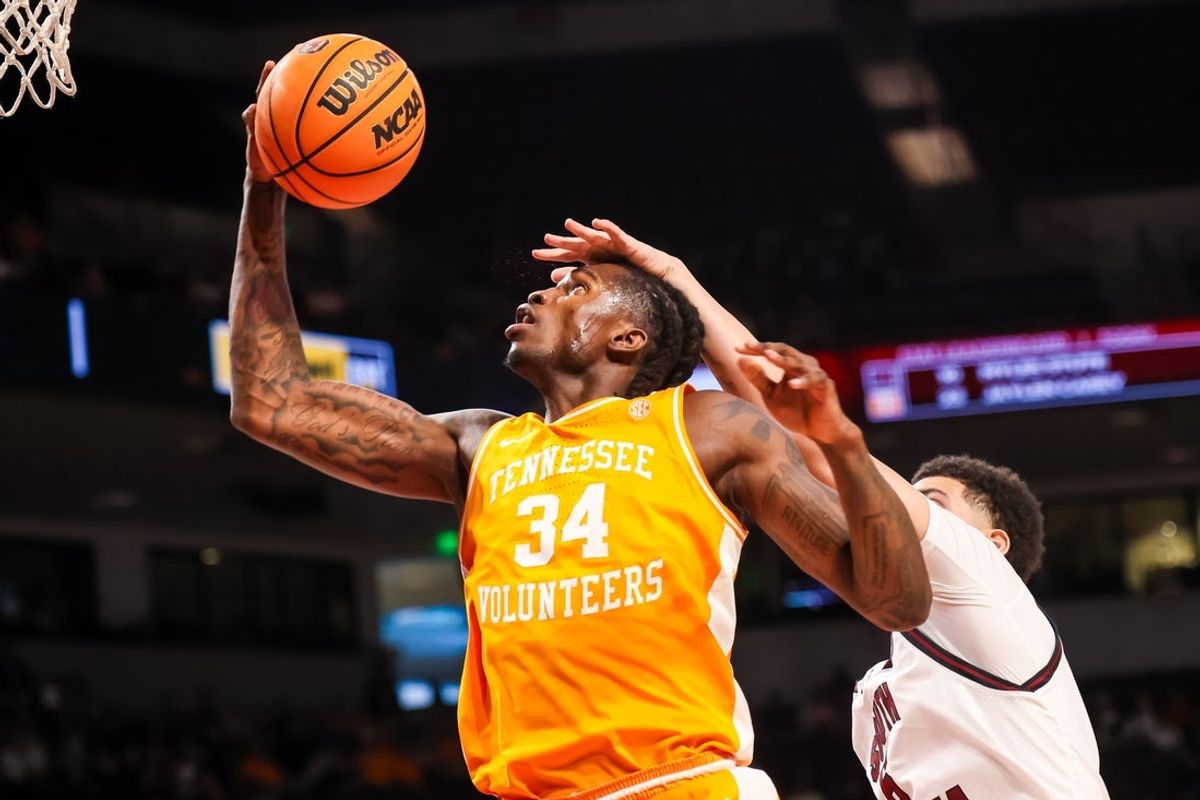 Mar 3, 2026; Columbia, South Carolina, USA; Tennessee Volunteers center Felix Okpara (34) grabs a rebound in front of South Carolina Gamecocks forward EJ Walker (6) in the first half at Colonial Life Arena. Mandatory Credit: Jeff Blake-Imagn Images