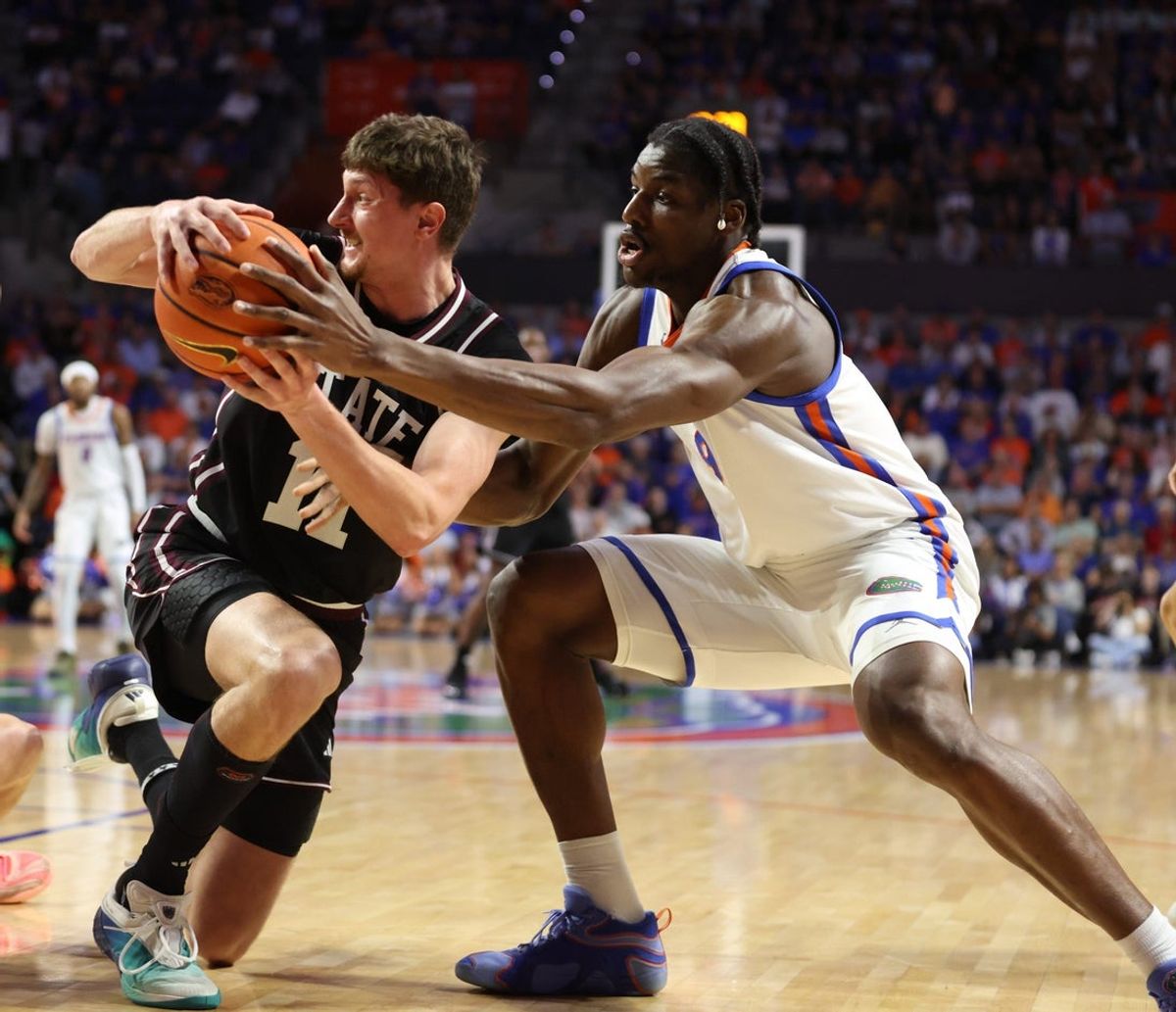 Mississippi State forward Sergej MacUra (11) and Florida center Rueben Chinyelu (9) fight for the ball during the first half of an NCAA mens basketball game at Steven C. O'Connell Center Exactek arena in Gainesville, FL on Tuesday, March 3, 2026. [Alan Youngblood/Gainesville Sun]
