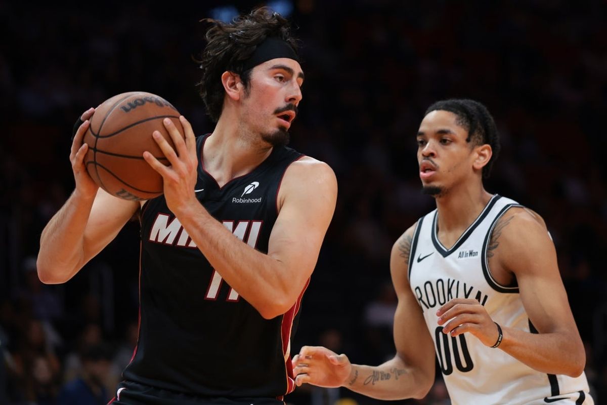 Mar 3, 2026; Miami, Florida, USA; Miami Heat forward Jaime Jaquez Jr. (11) protects the basketball from Brooklyn Nets forward Josh Minott (00) during the second quarter at Kaseya Center. Mandatory Credit: Sam Navarro-Imagn Images