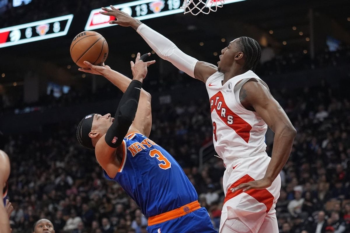 Mar 3, 2026; Toronto, Ontario, CAN; Toronto Raptors forward RJ Barrett (9) blocks a shot attempt by New York Knicks forward Josh Hart (3) during the first half at Scotiabank Arena. Mandatory Credit: John E. Sokolowski-Imagn Images