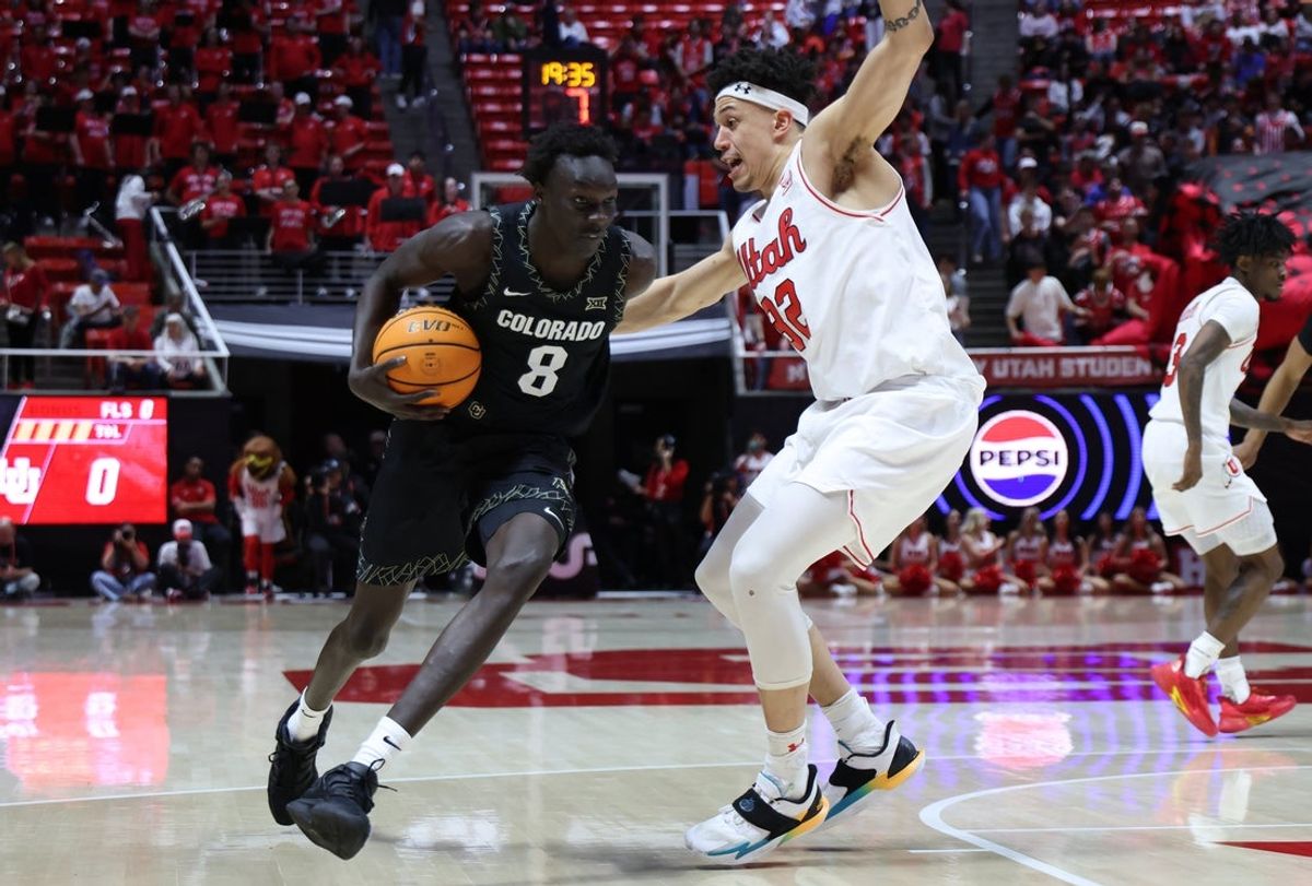 Mar 3, 2026; Salt Lake City, Utah, USA; Colorado Buffaloes forward Bangot Dak (8) drives against Utah Utes forward James Okonkwo (32) during the first half at Jon M. Huntsman Center. Mandatory Credit: Rob Gray-Imagn Images