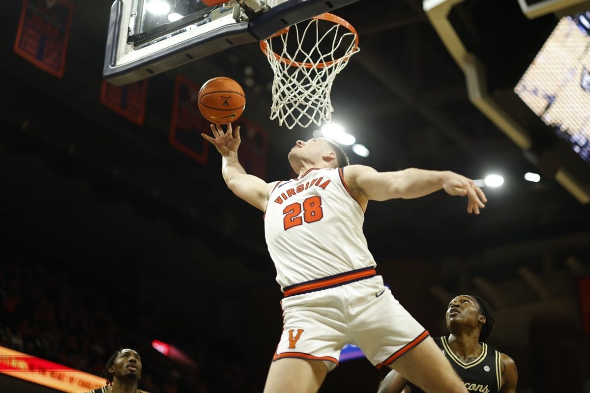 Mar 3, 2026; Charlottesville, Virginia, USA; Virginia Cavaliers forward Thijs de Ridder (28) shoots the ball as Wake Forest Demon Deacons guard Mekhi Mason (8) looks on in the second half at John Paul Jones Arena. Mandatory Credit: Geoff Burke-Imagn Images