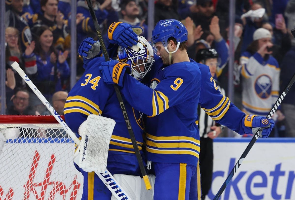 Mar 3, 2026; Buffalo, New York, USA;  Buffalo Sabres goaltender Alex Lyon (34) celebrates a win with center Josh Norris (9) against the Vegas Golden Knights at KeyBank Center. Mandatory Credit: Timothy T. Ludwig-Imagn Images