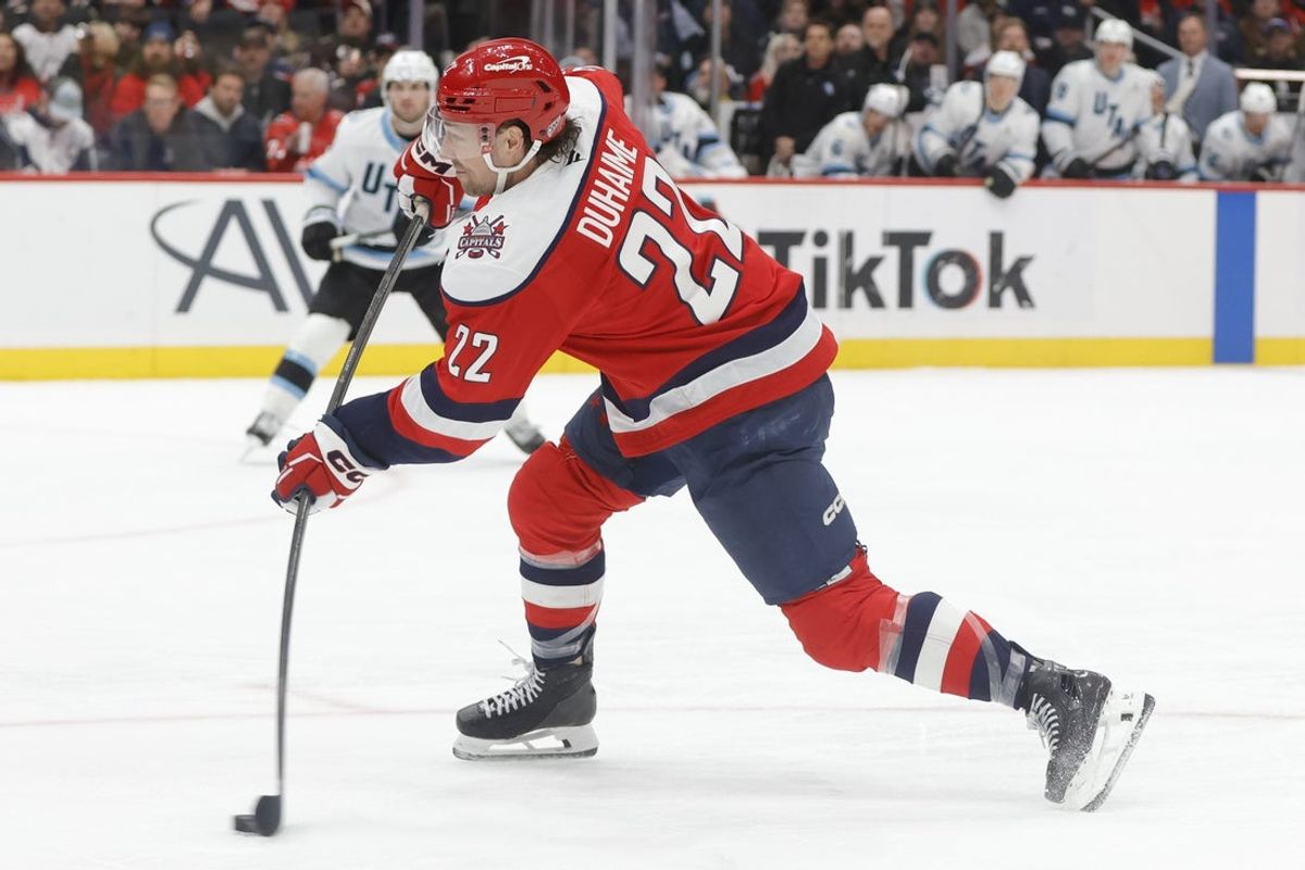 Mar 3, 2026; Washington, District of Columbia, USA; Washington Capitals right wing Brandon Duhaime (22) shoots the puck against the Utah Mammoth during the third period at Capital One Arena. Mandatory Credit: Amber Searls-Imagn Images