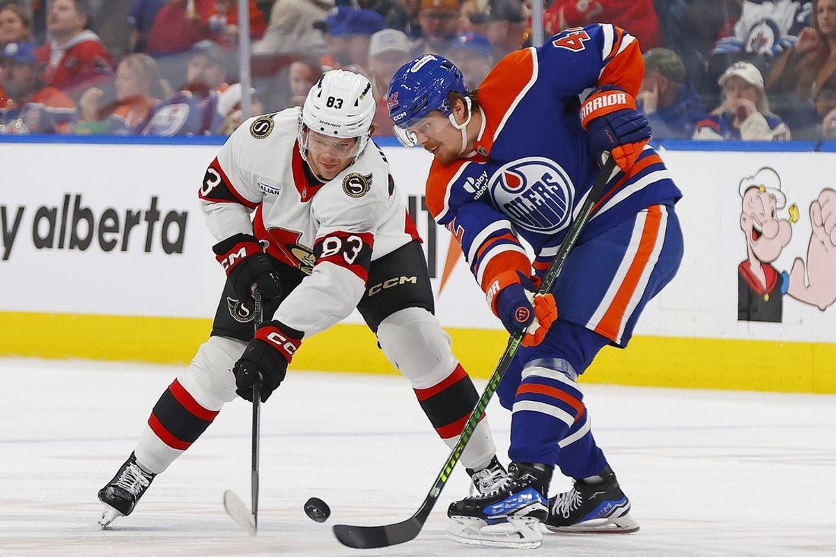 Mar 3, 2026; Edmonton, Alberta, CAN; Ottawa Senators forward Steve Halliday (83) and Edmonton Oilers forward Kasperi Kapanen (42) battle for a loose puck during the second period at Rogers Place. Mandatory Credit: Perry Nelson-Imagn Images