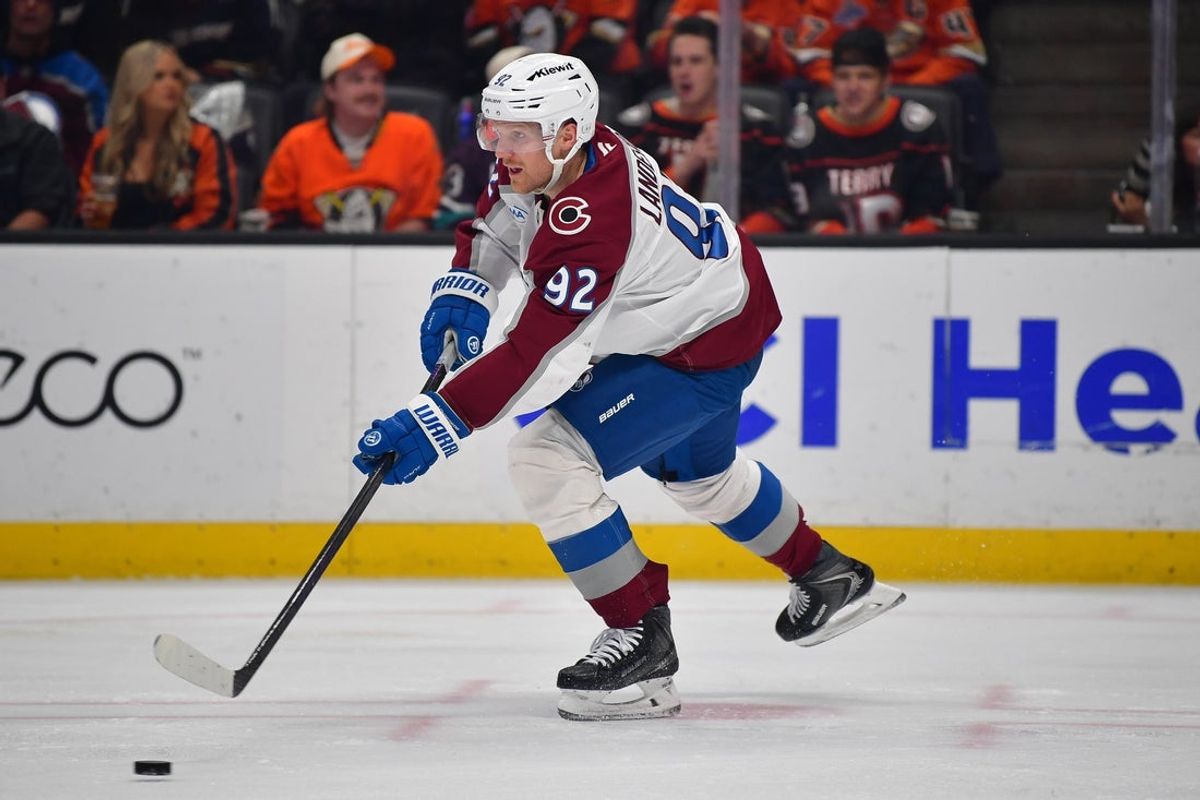 Mar 3, 2026; Anaheim, California, USA; Colorado Avalanche left wing Gabriel Landeskog (92) controls the puck against the Anaheim Ducks during the second period at Honda Center. Mandatory Credit: Gary A. Vasquez-Imagn Images