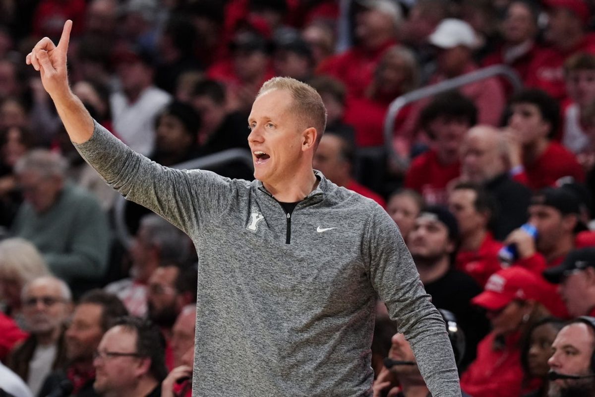 Mar 3, 2026; Cincinnati, Ohio, USA; BYU Cougars head coach Kevin Young works the sideline against the Cincinnati Bearcats in the first half at Fifth Third Arena. Mandatory Credit: Aaron Doster-Imagn Images