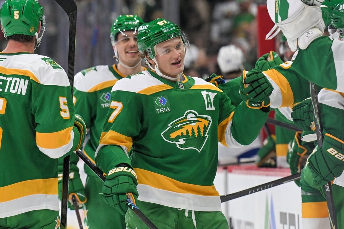 Mar 3, 2026; Saint Paul, Minnesota, USA;  Minnesota Wild forward Kirill Kaprizov (97) is congratulated by teammates after taking sole possession as the franchise leader in goals on an empty netter against the Tampa Bay Lightning during the third period at Grand Casino Arena. Mandatory Credit: Nick Wosika-Imagn Images