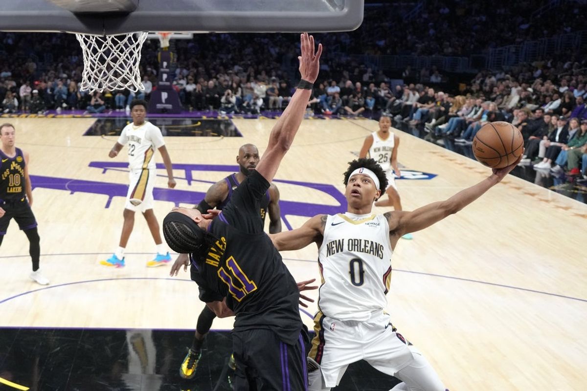Mar 3, 2026; Los Angeles, California, USA; New Orleans Pelicans guard Jeremiah Fears (0) shoots the ball against Los Angeles Lakers center Jaxson Hayes (11) in the second half at Crypto.com Arena. Mandatory Credit: Kirby Lee-Imagn Images