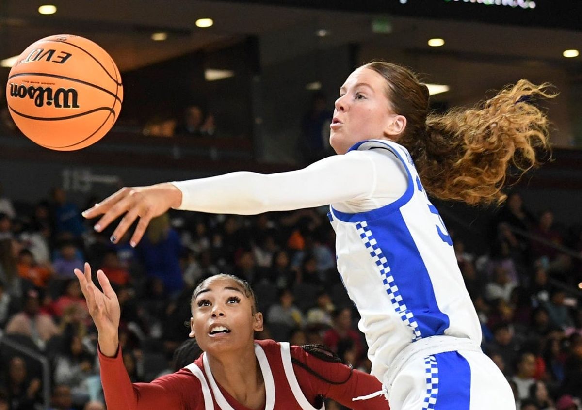 Kentucky Wildcats forward Amelia Hassett (32) blocks the shot of Arkansas Razorbacks guard Taleyah Jones (10) Wednesday, March 4, 2026, during the SEC Women's Basketball Tournament first round game at Bon Secours Wellness Arena in Greenville, South Carolina.
