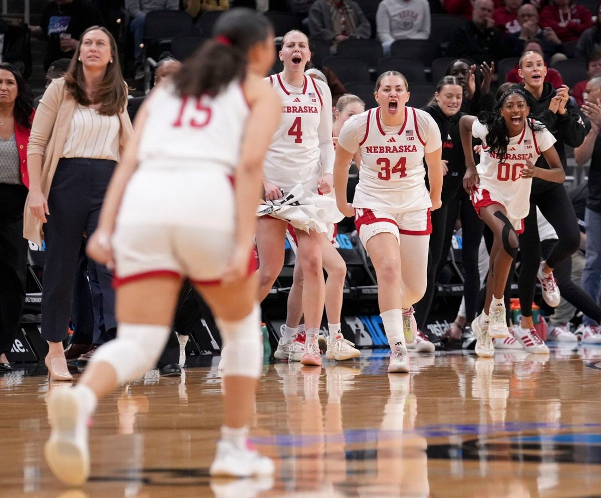 The Nebraska Cornhuskers bench celebrates after their team scores against the Indiana Hoosiers during a Big Ten women's basketball tournament game Wednesday, March 4, 2026, at Gainbridge Fieldhouse in Indianapolis. Indiana defeated Nebraska 72-69.