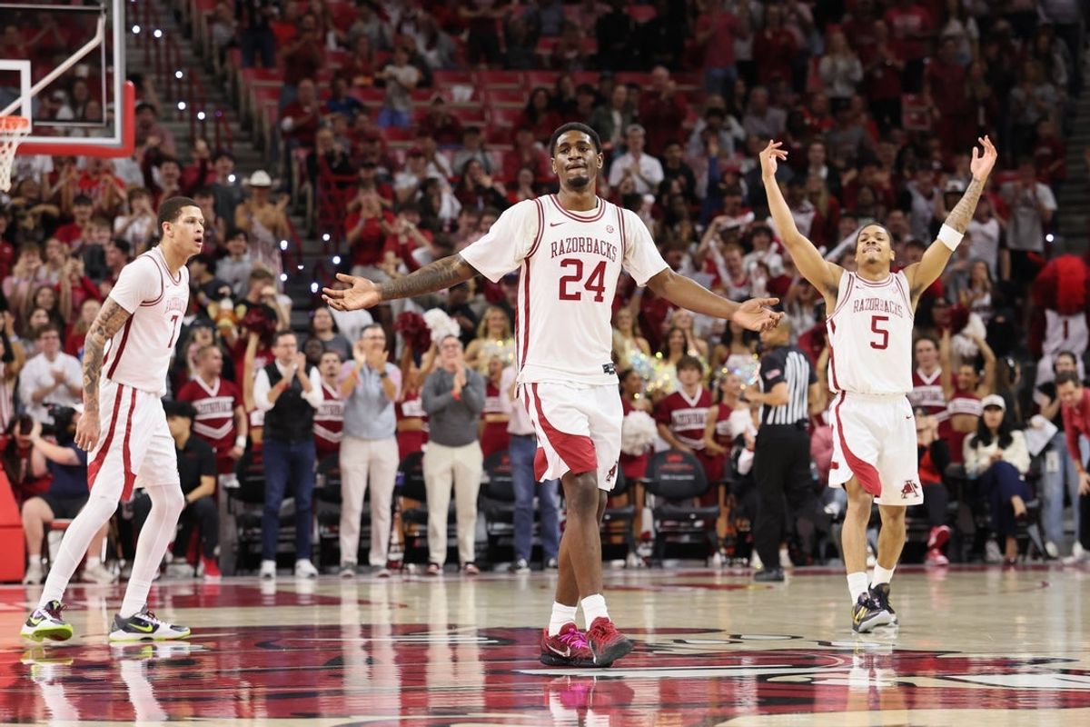 Mar 4, 2026; Fayetteville, Arkansas, USA; Arkansas Razorbacks wing Billy Richmond III (24) and guard Darius Acuff Jr (5) celebrate after a play against the Texas Longhorns during the first half at Bud Walton Arena. Mandatory Credit: Nelson Chenault-Imagn Images