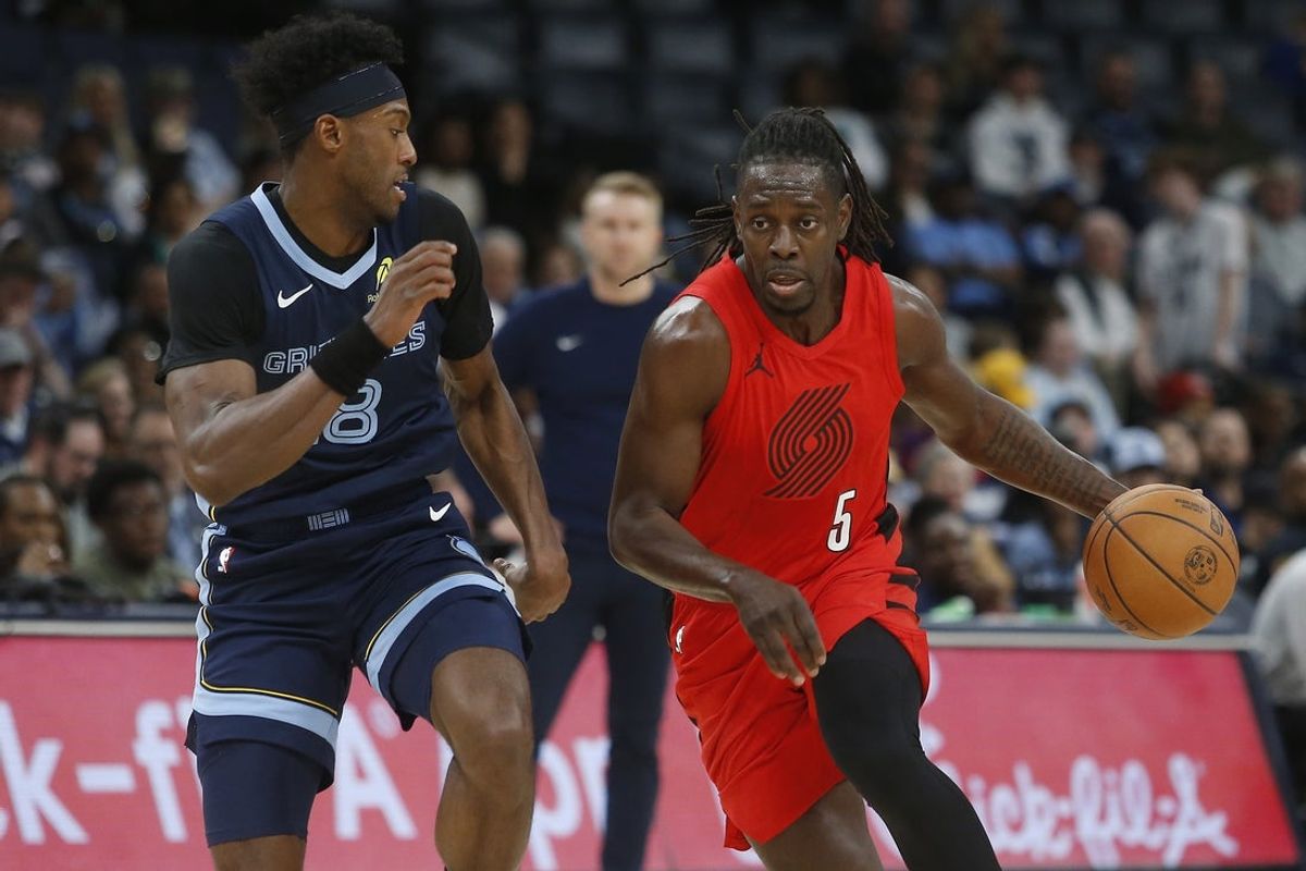 Mar 4, 2026; Memphis, Tennessee, USA; Portland Trail Blazers guard Jrue Holiday (5) drives to the basket as Memphis Grizzlies forward Olivier-Maxence Prosper (18) defends during the second quarter at FedExForum. Mandatory Credit: Petre Thomas-Imagn Images