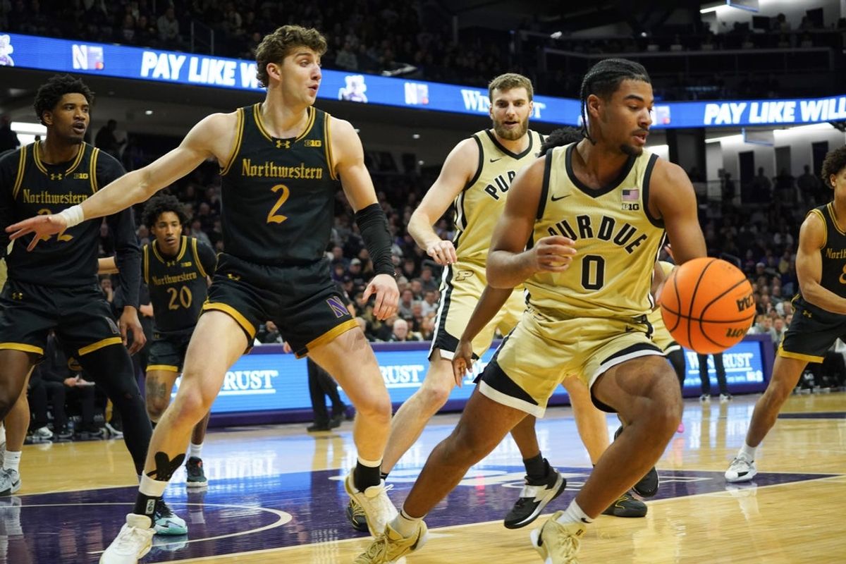 Mar 4, 2026; Evanston, Illinois, USA; Northwestern Wildcats forward Nick Martinelli (2) defends Purdue Boilermakers guard C.J. Cox (0) during the first half at Welsh-Ryan Arena. Mandatory Credit: David Banks-Imagn Images