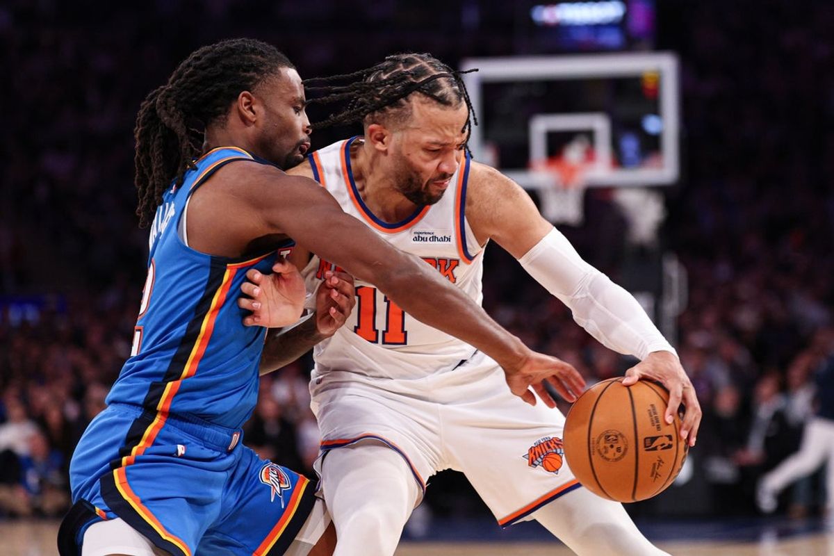 Mar 4, 2026; New York, New York, USA; New York Knicks guard Jalen Brunson (11) is guarded by Oklahoma City Thunder guard Shai Gilgeous-Alexander (2) during the second half at Madison Square Garden. Mandatory Credit: Vincent Carchietta-Imagn Images
