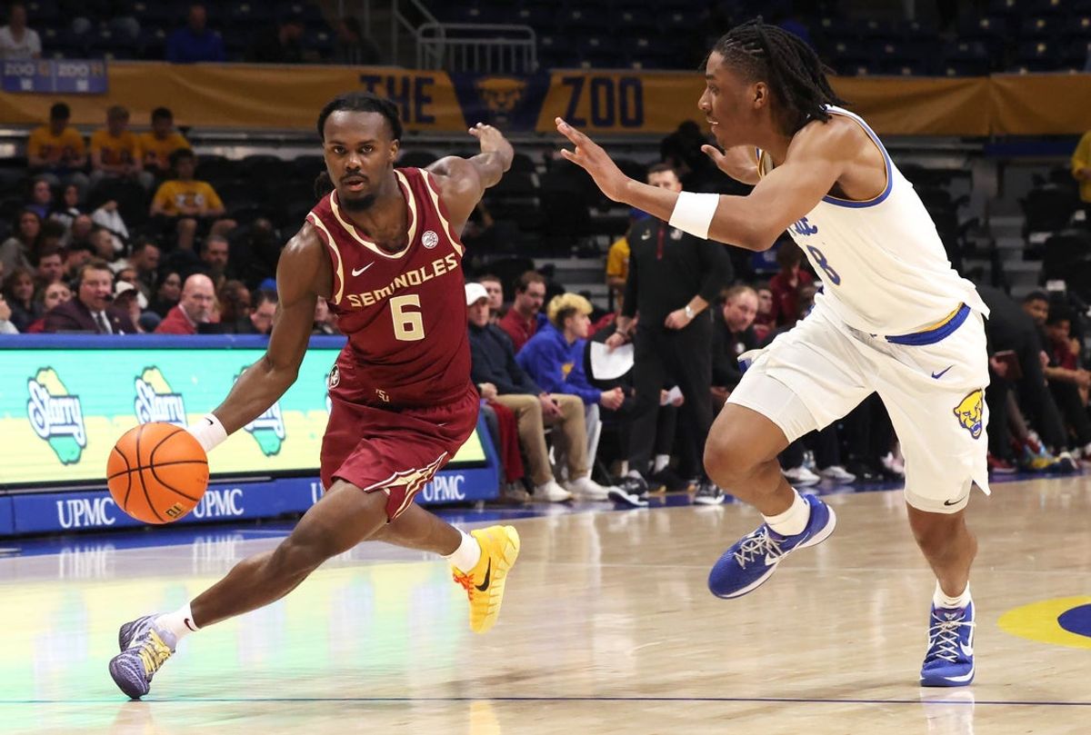 Mar 4, 2026; Pittsburgh, Pennsylvania, USA;  Florida State Seminoles guard Robert McCray V. (6) drives to the basket against Pittsburgh Panthers guard Omari Witherspoon (8) during the first half at the Petersen Events Center. Mandatory Credit: Charles LeClaire-Imagn Images
