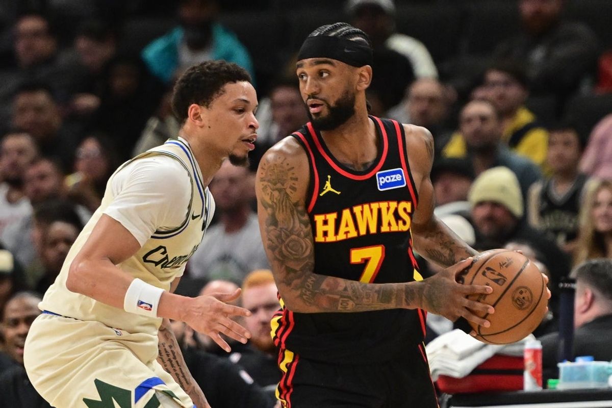 Mar 4, 2026; Milwaukee, Wisconsin, USA; Atlanta Hawks guard Nickeil Alexander-Walker (7) looks for a shot against Milwaukee Bucks guard Ryan Rollins (13) in the second quarter at Fiserv Forum. Mandatory Credit: Benny Sieu-Imagn Images