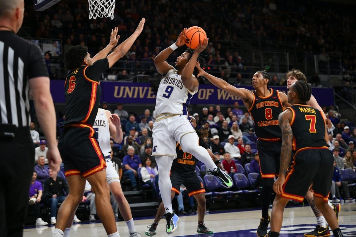Mar 4, 2026; Seattle, Washington, USA; Washington Huskies guard Wesley Yates III (9) shoots the ball while guarded by Southern California Trojans forward Jacob Cofie (6) and Southern California Trojans guard Jerry Easter II (8) during the first half at Alaska Airlines Arena at Hec Edmundson Pavilion. Mandatory Credit: Steven Bisig-Imagn Images