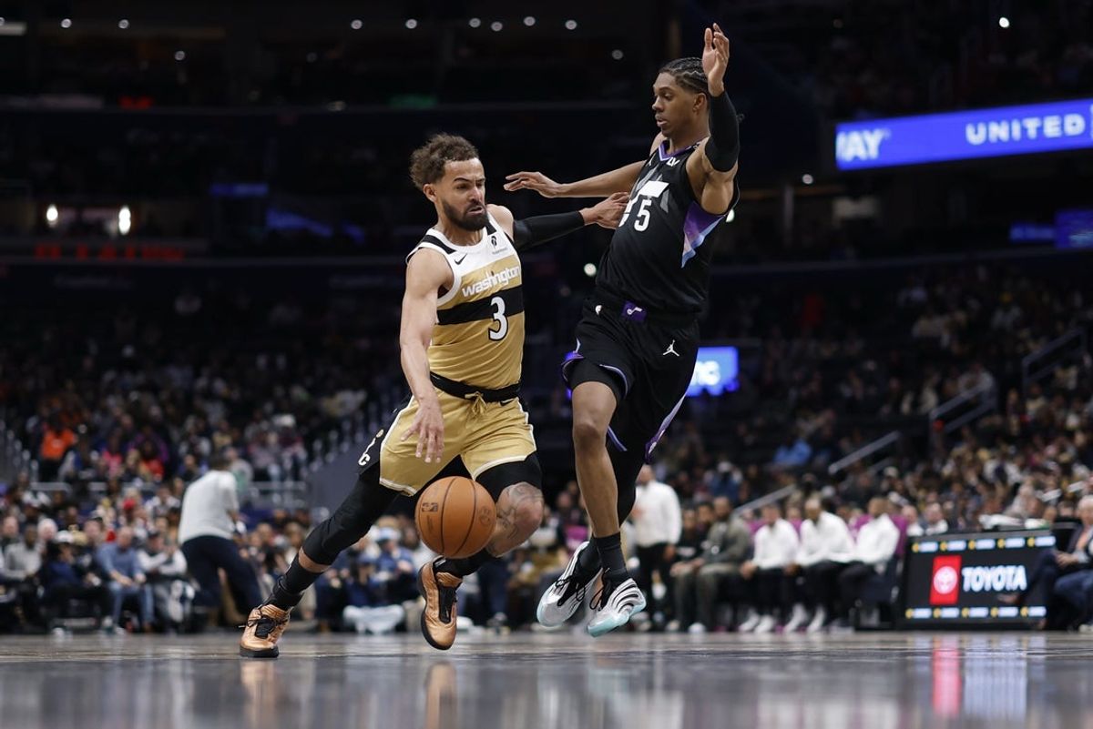 Mar 5, 2026; Washington, District of Columbia, USA; Washington Wizards guard Trae Young (3) drives to the basket as Utah Jazz forward Cody Williams (5) defends in the first half at Capital One Arena. Mandatory Credit: Geoff Burke-Imagn Images