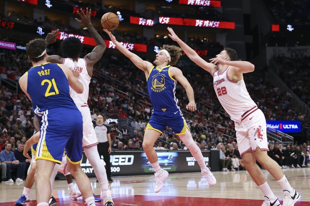Mar 5, 2026; Houston, Texas, USA; Golden State Warriors guard Brandin Podziemski (2) shoots the ball as Houston Rockets center Alperen Sengun (28) defends during the second quarter at Toyota Center. Mandatory Credit: Troy Taormina-Imagn Images