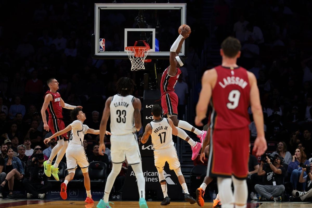 Mar 5, 2026; Miami, Florida, USA; Miami Heat center Bam Adebayo (13) dunks against the Brooklyn Nets during the first quarter at Kaseya Center. Mandatory Credit: Sam Navarro-Imagn Images
