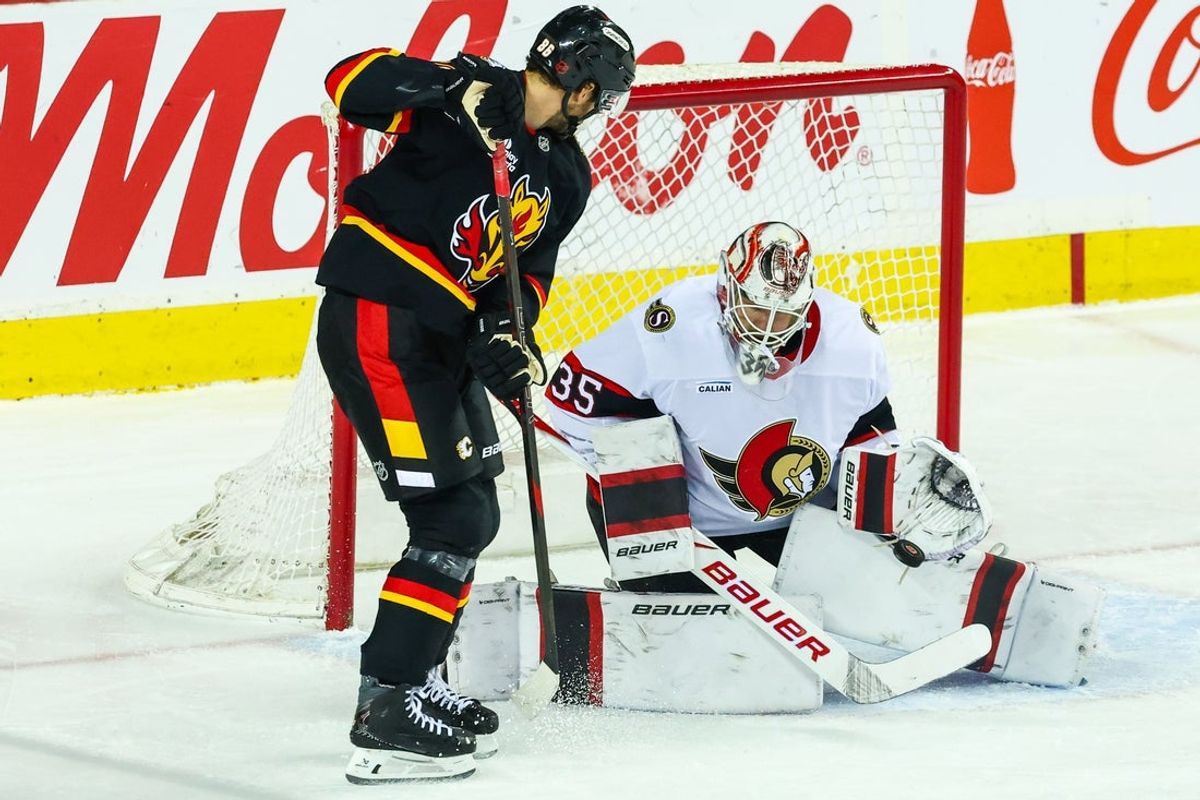 Mar 5, 2026; Calgary, Alberta, CAN; Ottawa Senators goaltender Linus Ullmark (35) makes a save against Calgary Flames left wing Joel Farabee (86) during the first period at Scotiabank Saddledome. Mandatory Credit: Sergei Belski-Imagn Images