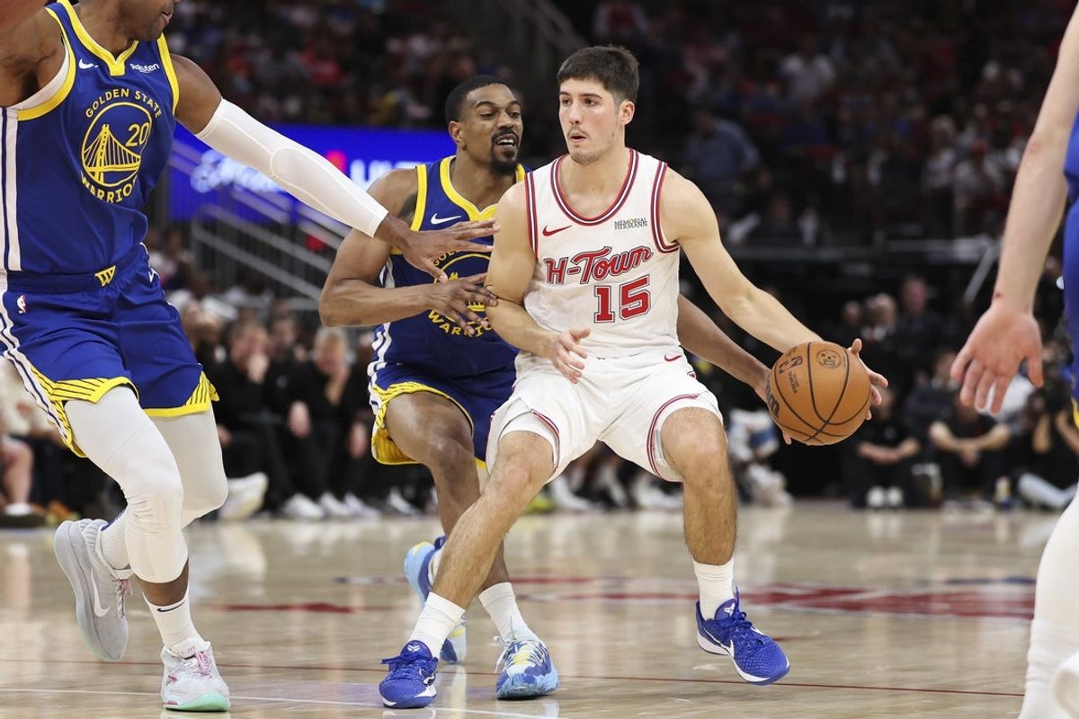 Mar 5, 2026; Houston, Texas, USA; Golden State Warriors guard De'anthony Melton (8) attempts to steal the ball from Houston Rockets guard Reed Sheppard (15) during the fourth quarter at Toyota Center. Mandatory Credit: Troy Taormina-Imagn Images
