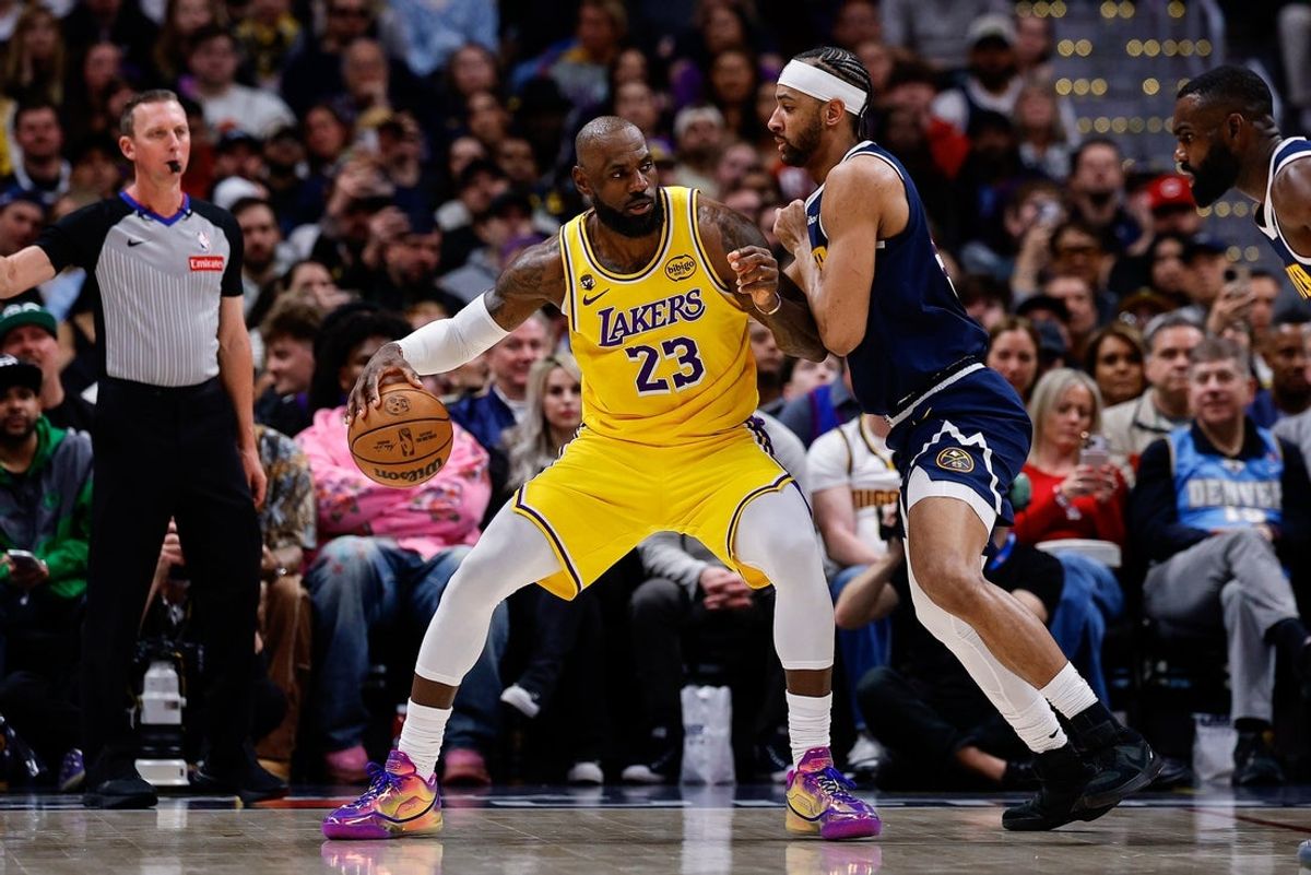 Mar 5, 2026; Denver, Colorado, USA; Los Angeles Lakers forward LeBron James (23) controls the ball against Denver Nuggets forward Zeke Nnaji (22) in the first quarter at Ball Arena. Mandatory Credit: Isaiah J. Downing-Imagn Images