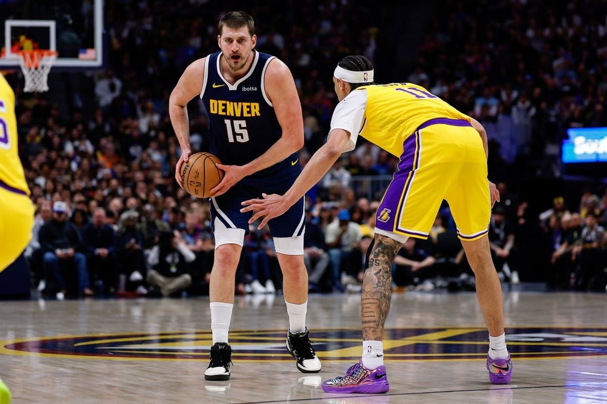 Mar 5, 2026; Denver, Colorado, USA; Denver Nuggets center Nikola Jokic (15) controls the ball as Los Angeles Lakers center Jaxson Hayes (11) guards in the first quarter at Ball Arena. Mandatory Credit: Isaiah J. Downing-Imagn Images