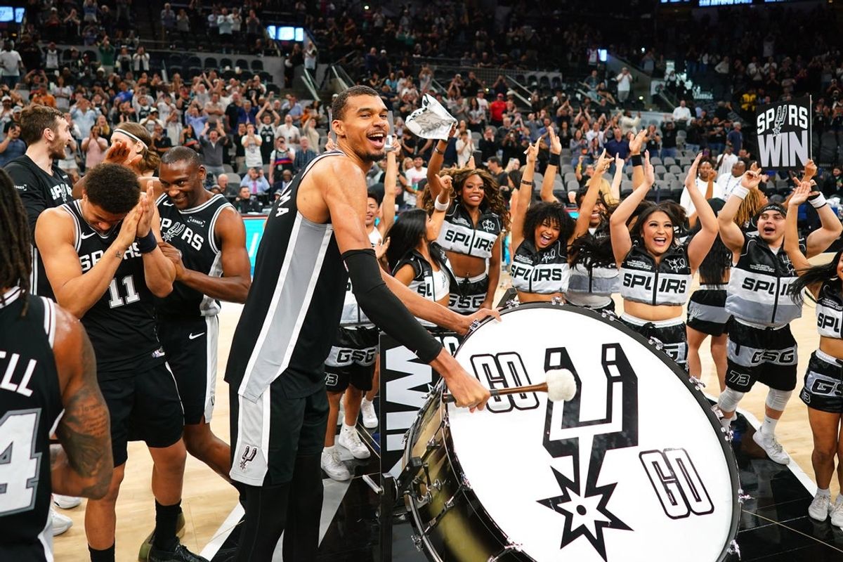 Mar 5, 2026; San Antonio, Texas, USA; San Antonio Spurs forward forward Victor Wembanyama (1) beats a drum and leads fans on a cheer after a victory over the Detroit Pistons at Frost Bank Center. Mandatory Credit: Scott Wachter-Imagn Images